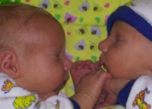 Holding hands sleeping at 11 days old (Jacob left, Esau right)